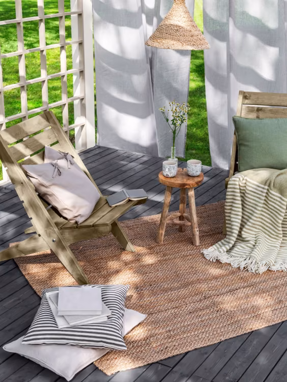 garden furniture and carpet on wooden deck