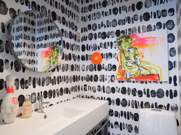 black-and-white decorative pattern on the walls of guest WC