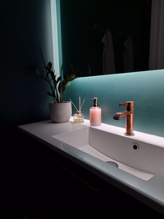 bathroom wall painted in dark green