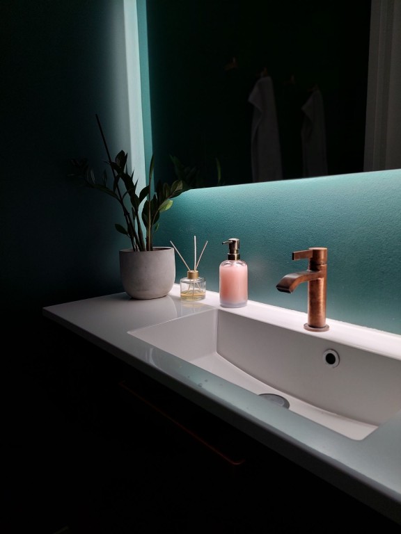 bathroom wall painted in dark green