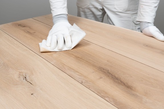 wiping furniture by cloth