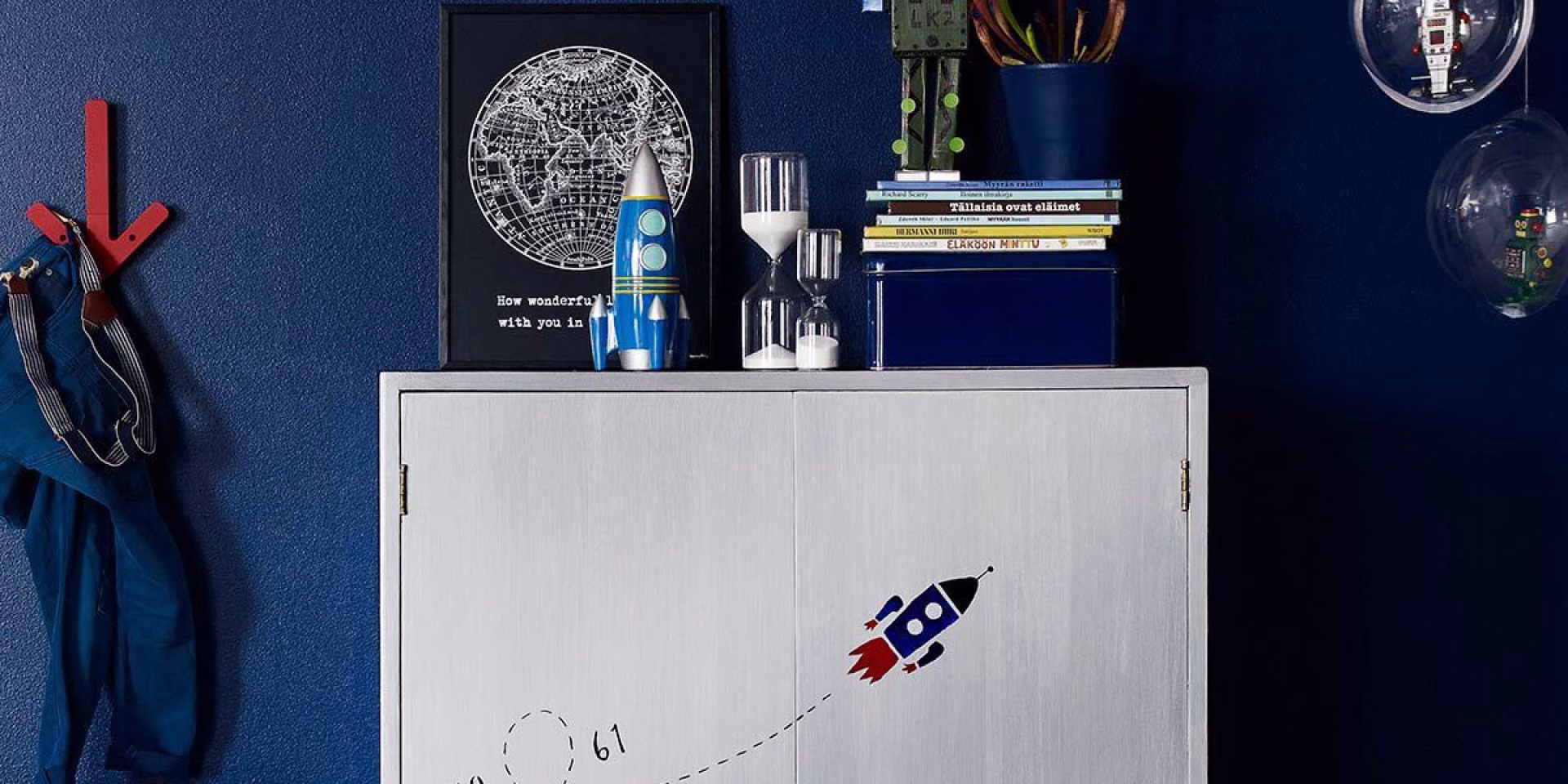 sliver colour cabinet and blue walls