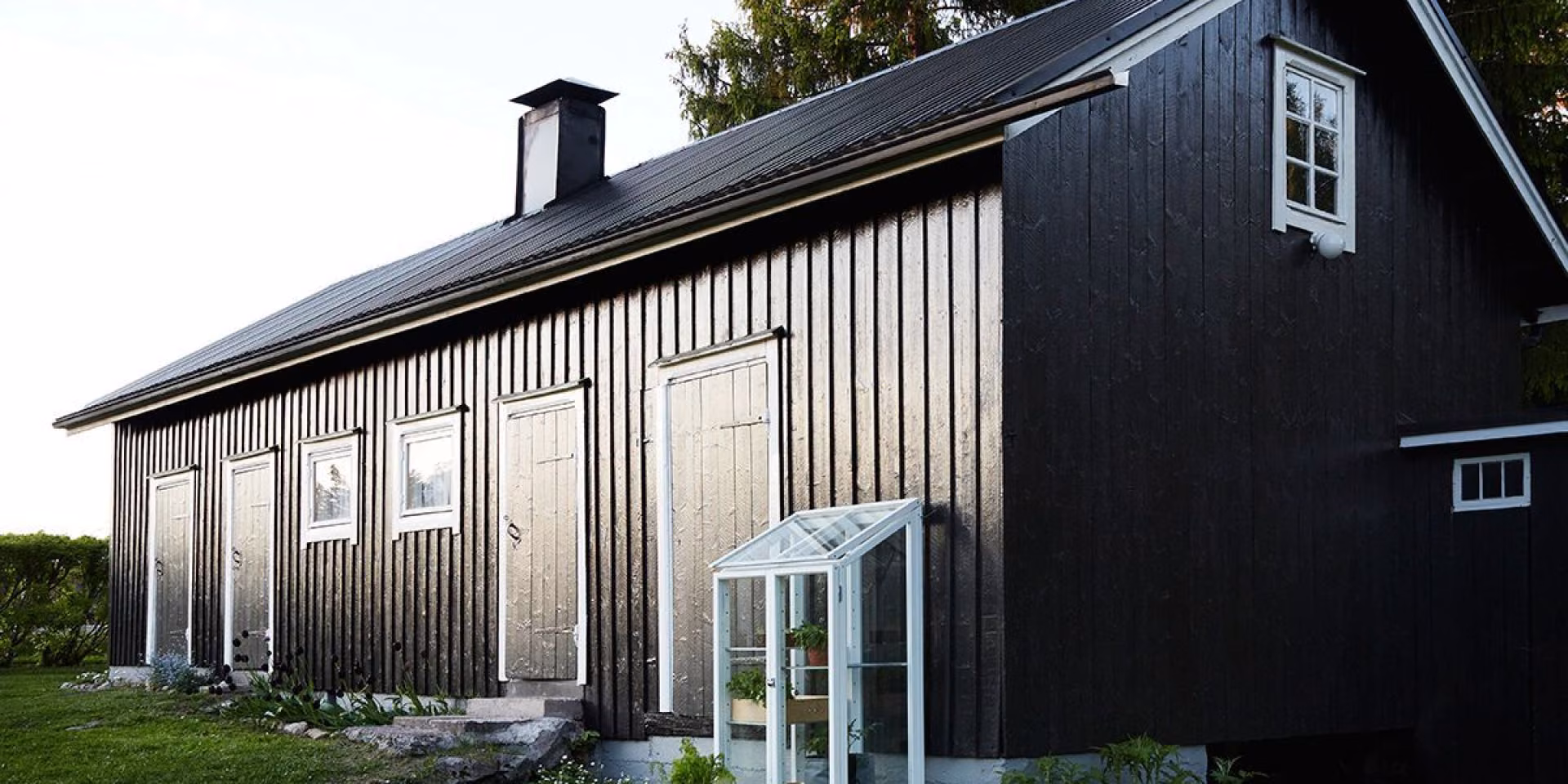 painting barn into black