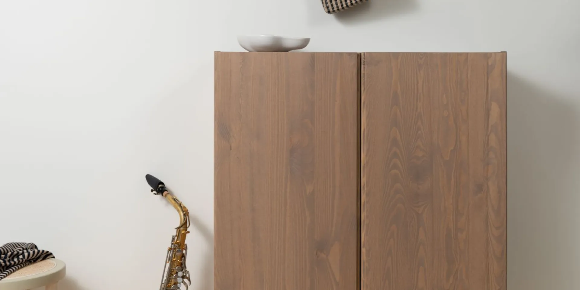 Wooden cabinet treated with furniture lacquer